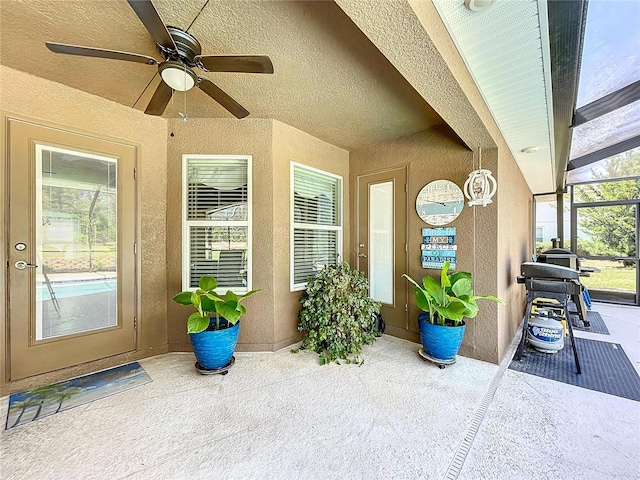 9152 Bunting Rd, Weeki Wachee, FL 34613 - entrance to property with a ceiling fan, stucco siding, and a patio