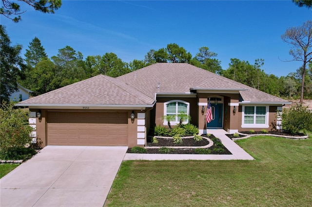 9152 Bunting Rd, Weeki Wachee, FL 34613 - ranch-style home featuring stucco siding, an attached garage, a front yard, and concrete driveway