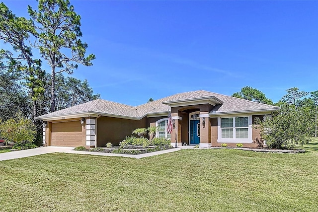 9152 Bunting Rd, Weeki Wachee, FL 34613 - view of front of property with an attached garage, a front yard, stucco siding, and driveway