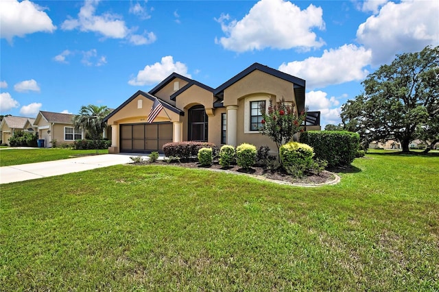 10155 Duffy Cir, Weeki Wachee, FL 34613 - view of front of house featuring stucco siding, a garage, concrete driveway, and a front yard