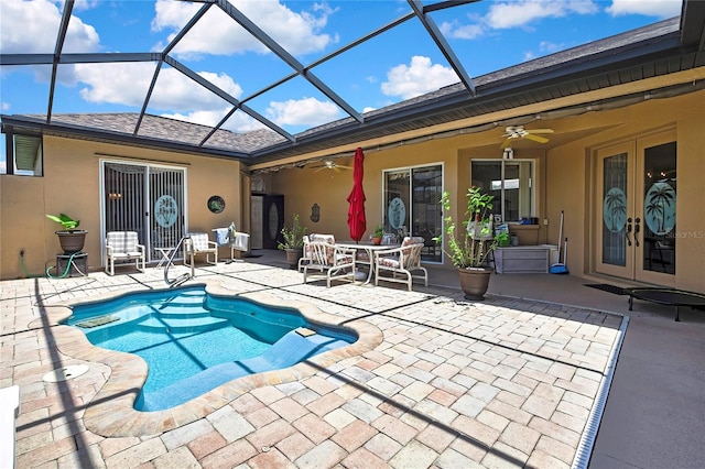 10155 Duffy Cir, Weeki Wachee, FL 34613 - outdoor pool with ceiling fan, french doors, a patio area, and a lanai