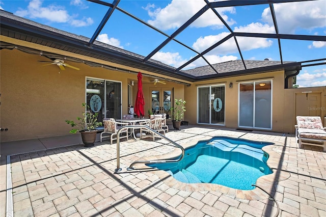 10155 Duffy Cir, Weeki Wachee, FL 34613 - outdoor pool featuring a patio, ceiling fan, and glass enclosure