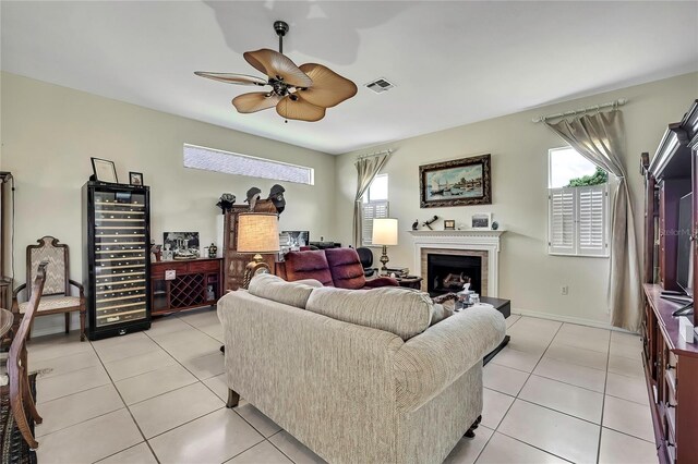 10155 Duffy Cir, Weeki Wachee, FL 34613 - living area with beverage cooler, plenty of natural light, and light tile patterned flooring