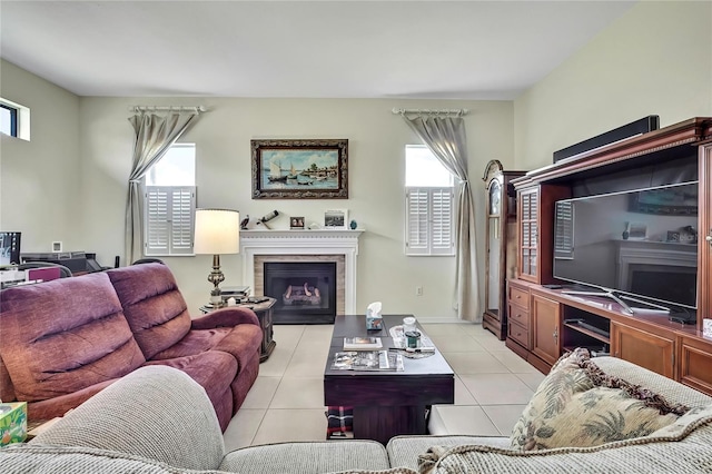 10155 Duffy Cir, Weeki Wachee, FL 34613 - living area with a glass covered fireplace and light tile patterned flooring