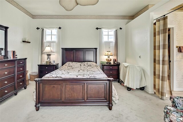 10155 Duffy Cir, Weeki Wachee, FL 34613 - bedroom featuring light carpet, multiple windows, and baseboards