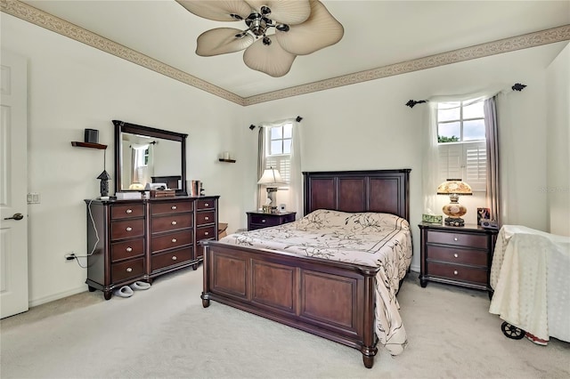 10155 Duffy Cir, Weeki Wachee, FL 34613 - bedroom with light colored carpet, multiple windows, and a ceiling fan