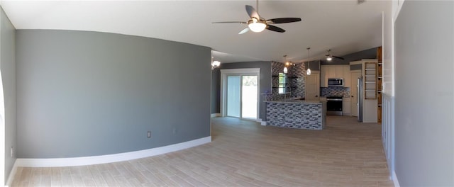 6172 Raleigh St, Spring Hill, FL 34606 - unfurnished living room featuring vaulted ceiling, a ceiling fan, baseboards, and light wood-style floors