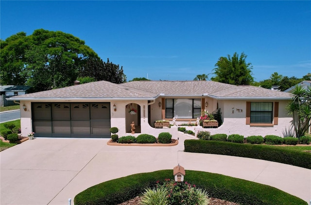 10111 Glen Moor Ln, Port Richey, FL 34668 - single story home featuring curved driveway, stucco siding, an attached garage, and a shingled roof