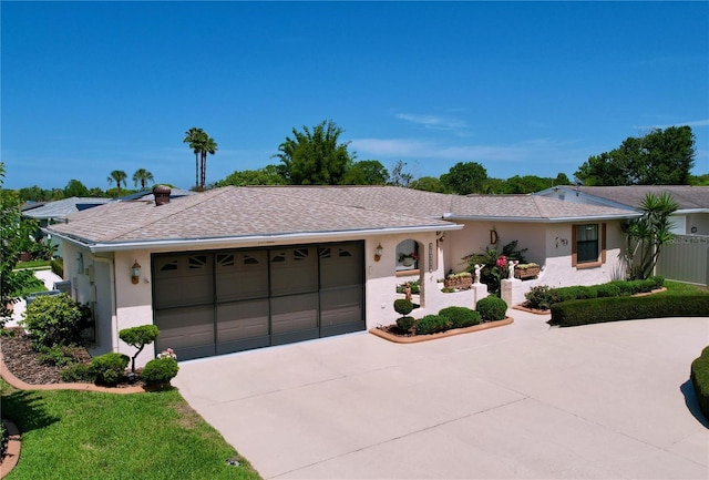 10111 Glen Moor Ln, Port Richey, FL 34668 - ranch-style home with concrete driveway, a garage, and stucco siding