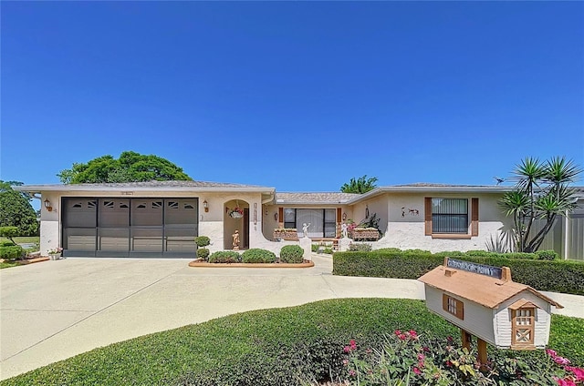 10111 Glen Moor Ln, Port Richey, FL 34668 - single story home with stucco siding, driveway, and a garage