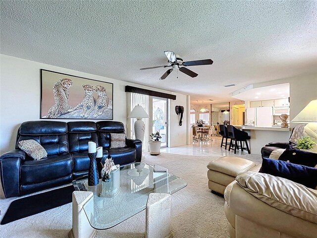 10111 Glen Moor Ln, Port Richey, FL 34668 - living area featuring ceiling fan, carpet floors, and a textured ceiling