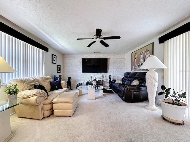 10111 Glen Moor Ln, Port Richey, FL 34668 - living room with carpet flooring, plenty of natural light, a ceiling fan, and a textured ceiling