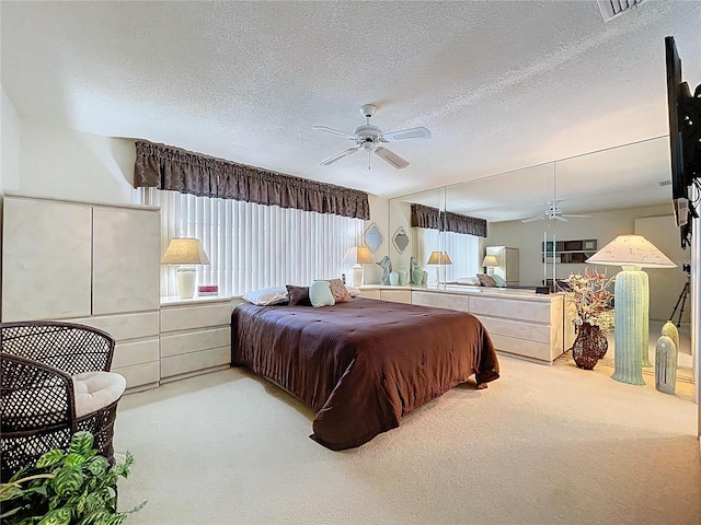 10111 Glen Moor Ln, Port Richey, FL 34668 - carpeted bedroom with a textured ceiling and a ceiling fan