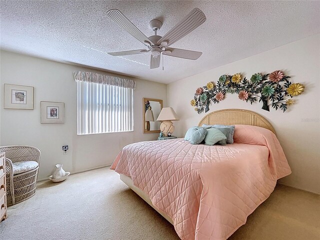 10111 Glen Moor Ln, Port Richey, FL 34668 - bedroom with carpet floors, ceiling fan, and a textured ceiling