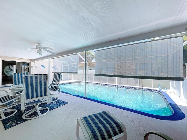 10111 Glen Moor Ln, Port Richey, FL 34668 - view of swimming pool featuring ceiling fan, a patio area, and a lanai