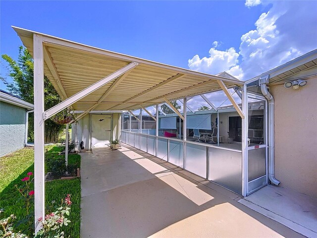 10111 Glen Moor Ln, Port Richey, FL 34668 - view of patio with a carport and a lanai