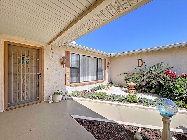 10111 Glen Moor Ln, Port Richey, FL 34668 - doorway to property featuring stucco siding