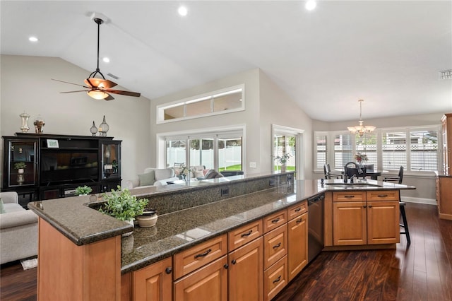 4923 Fort Peck Rd, New Port Richey, FL 34655 - kitchen featuring stainless steel dishwasher, open floor plan, ceiling fan, dark wood-type flooring, and high vaulted ceiling
