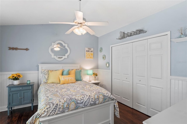 4923 Fort Peck Rd, New Port Richey, FL 34655 - bedroom featuring a wainscoted wall, a closet, wood finished floors, vaulted ceiling, and a ceiling fan