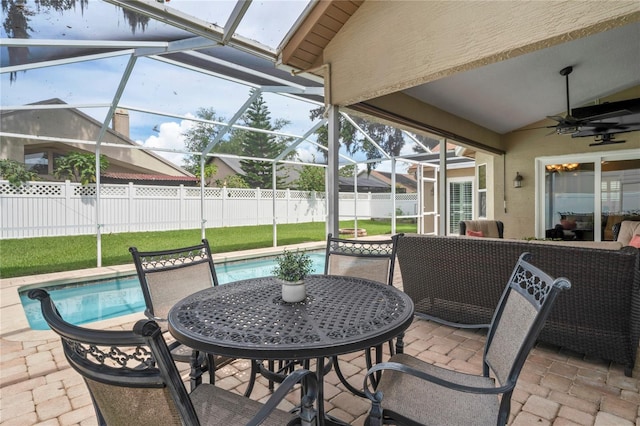 4923 Fort Peck Rd, New Port Richey, FL 34655 - view of patio with a ceiling fan, glass enclosure, and outdoor dining area