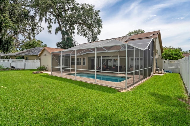 4923 Fort Peck Rd, New Port Richey, FL 34655 - back of house with a fenced backyard and a patio