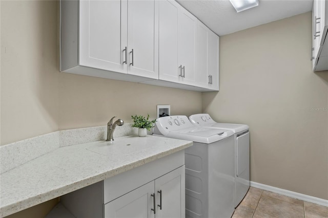 4923 Fort Peck Rd, New Port Richey, FL 34655 - laundry room featuring washer and dryer, cabinet space, and light tile patterned flooring