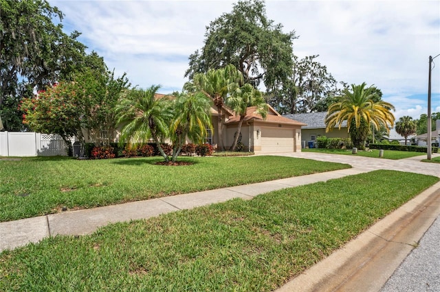 4923 Fort Peck Rd, New Port Richey, FL 34655 - view of front of property with concrete driveway, an attached garage, and stucco siding