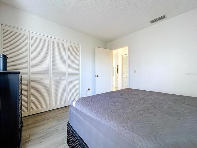 2139 Sea Pines Ct, Spring Hill, FL 34606 - bedroom with light wood-style floors and a closet
