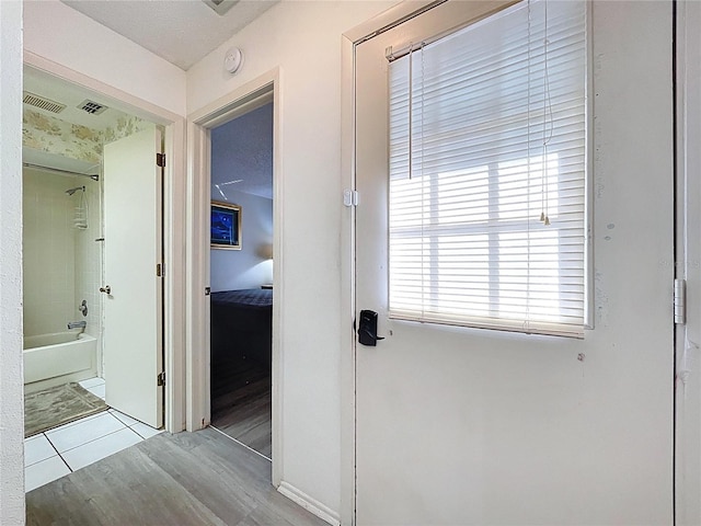2139 Sea Pines Ct, Spring Hill, FL 34606 - hallway featuring wood finished floors