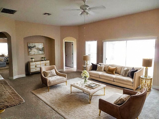 5701 Brackenwood Dr, Spring Hill, FL 34609 - carpeted living room featuring arched walkways and ceiling fan