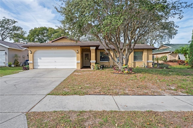 6315 Shane Ln, New Port Richey, FL 34653 - ranch-style home featuring stucco siding, a garage, driveway, and a front yard