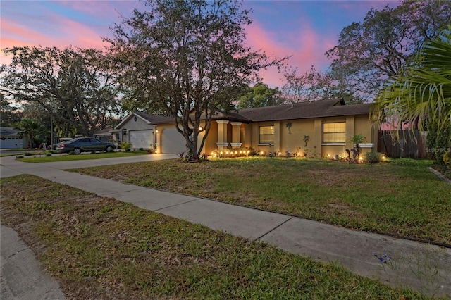 6315 Shane Ln, New Port Richey, FL 34653 - ranch-style home featuring driveway, stucco siding, and a garage