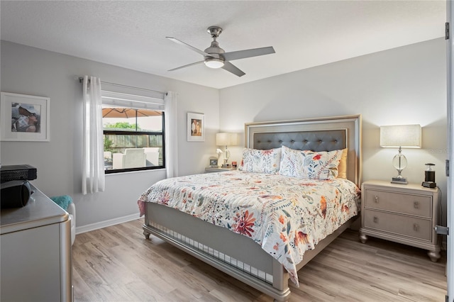 6315 Shane Ln, New Port Richey, FL 34653 - bedroom with wood finished floors, baseboards, and ceiling fan