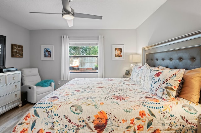 6315 Shane Ln, New Port Richey, FL 34653 - bedroom with wood finished floors and ceiling fan