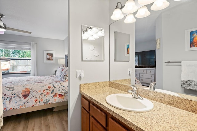 6315 Shane Ln, New Port Richey, FL 34653 - ensuite bathroom with wood finished floors, vanity, and a chandelier