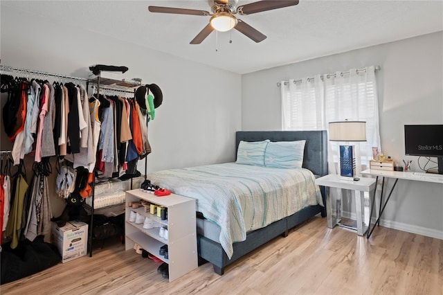6315 Shane Ln, New Port Richey, FL 34653 - bedroom with wood finished floors, a ceiling fan, and baseboards