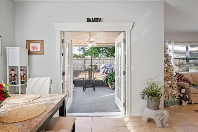 6315 Shane Ln, New Port Richey, FL 34653 - dining room with healthy amount of natural light, ceiling fan, tile patterned flooring, and carpet floors