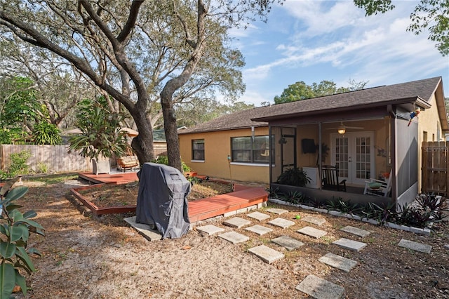 6315 Shane Ln, New Port Richey, FL 34653 - back of house with french doors, a wooden deck, stucco siding, and roof with shingles