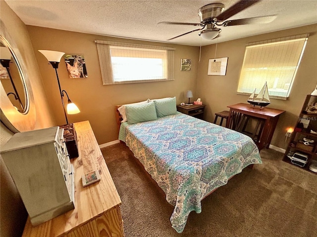 7861 Raintree Dr, New Port Richey, FL 34653 - bedroom with dark colored carpet, ceiling fan, baseboards, and a textured ceiling