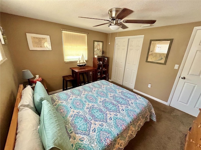 7861 Raintree Dr, New Port Richey, FL 34653 - carpeted bedroom featuring multiple windows, a closet, baseboards, ceiling fan, and a textured ceiling