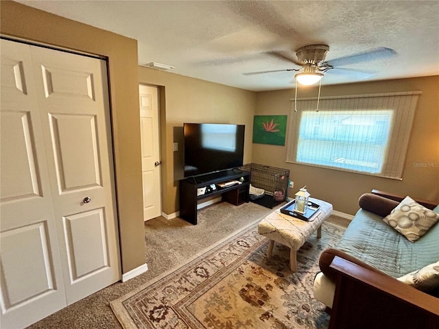 7861 Raintree Dr, New Port Richey, FL 34653 - carpeted living room featuring a ceiling fan, baseboards, and a textured ceiling