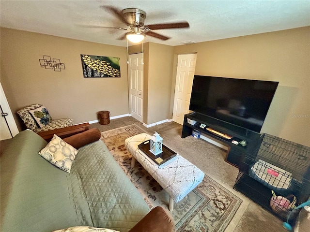 7861 Raintree Dr, New Port Richey, FL 34653 - carpeted living area with a ceiling fan and baseboards