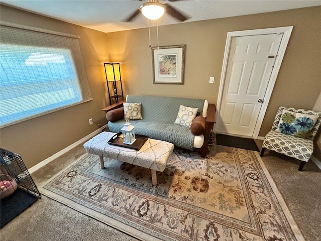 7861 Raintree Dr, New Port Richey, FL 34653 - carpeted living room featuring a ceiling fan and baseboards