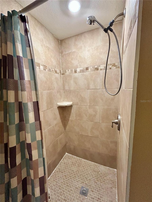 7861 Raintree Dr, New Port Richey, FL 34653 - full bath with a stall shower and a textured ceiling