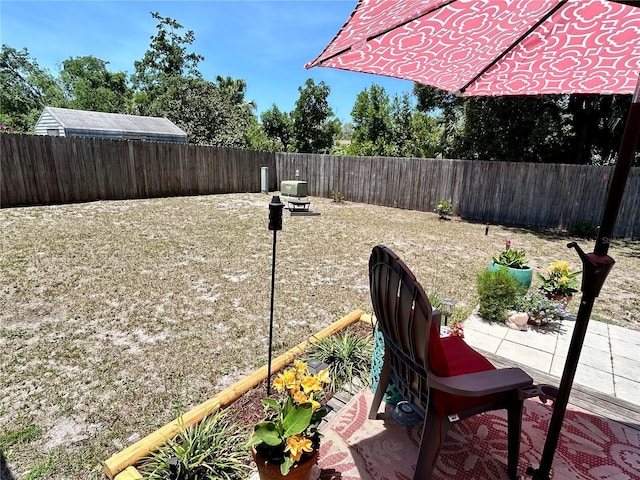 7861 Raintree Dr, New Port Richey, FL 34653 - fenced backyard featuring a patio area