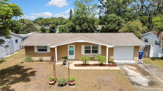 7861 Raintree Dr, New Port Richey, FL 34653 - ranch-style house featuring an attached garage, a shingled roof, driveway, and brick siding