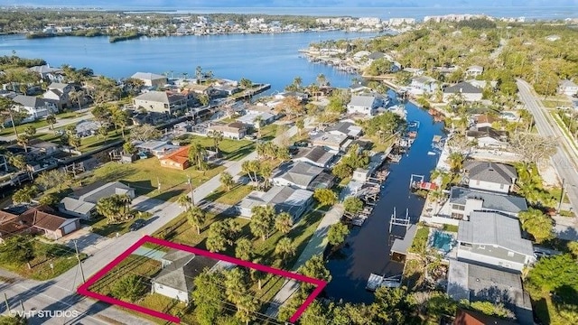 5447 Quist Dr, Port Richey, FL 34668 - aerial perspective of suburban area with a nearby body of water and property parcel outlined