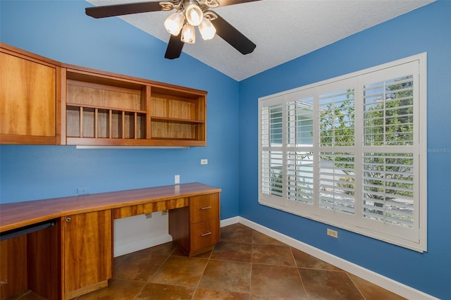 3609 Montclair Dr, New Port Richey, FL 34655 - unfurnished office with lofted ceiling, plenty of natural light, a ceiling fan, dark tile patterned flooring, and baseboards