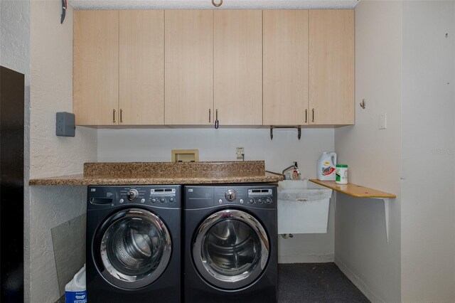 3609 Montclair Dr, New Port Richey, FL 34655 - laundry area featuring washing machine and dryer and cabinet space
