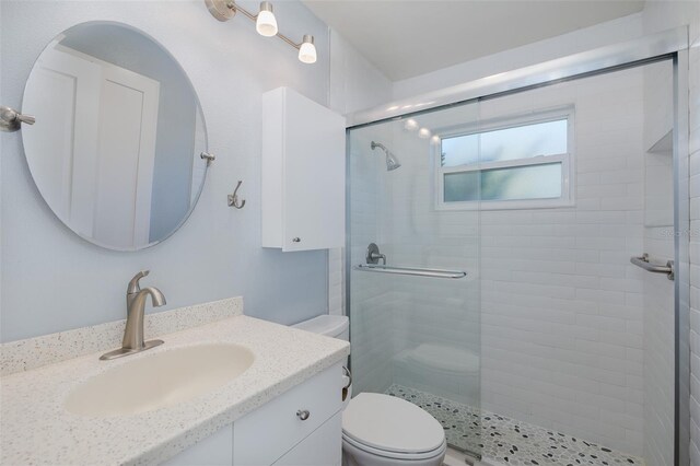 3609 Montclair Dr, New Port Richey, FL 34655 - bathroom with toilet, a stall shower, and vanity